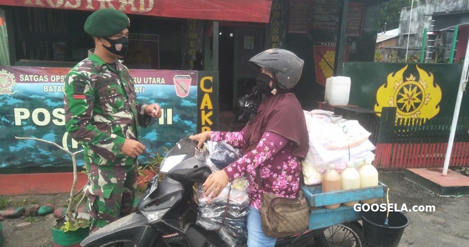 Satgas Yonarmed 9 Kostrad Menertibkan Penggunaan Masker di Desa Kao